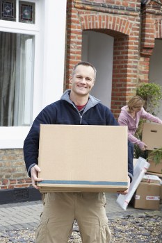 Removal van and moving boxes in an Ealing residential street