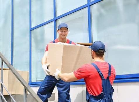 Office furniture and equipment being prepared for a commercial relocation
