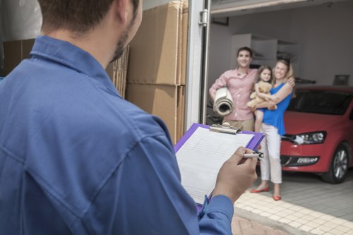 Removal team planning a house move in a residential Ealing street