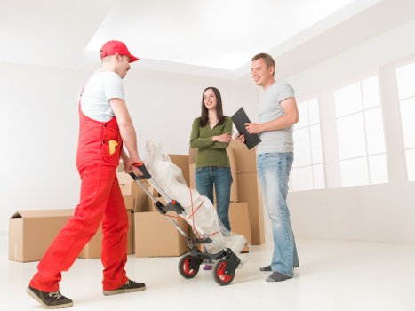 Moving team unloading furniture at a property in Ealing