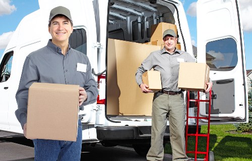 Packed moving boxes and furniture for a local removals job