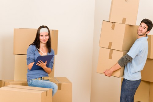 Moving team handling household items in an Ealing property